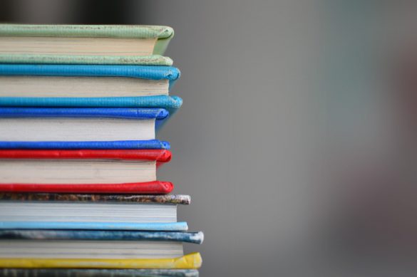 stack of books on desk