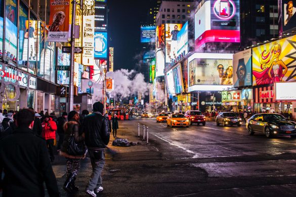 Crowded Street Filled with Ads