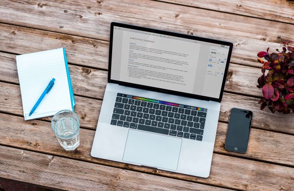 Computer and Notebook on Desk