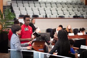 3 student at podium